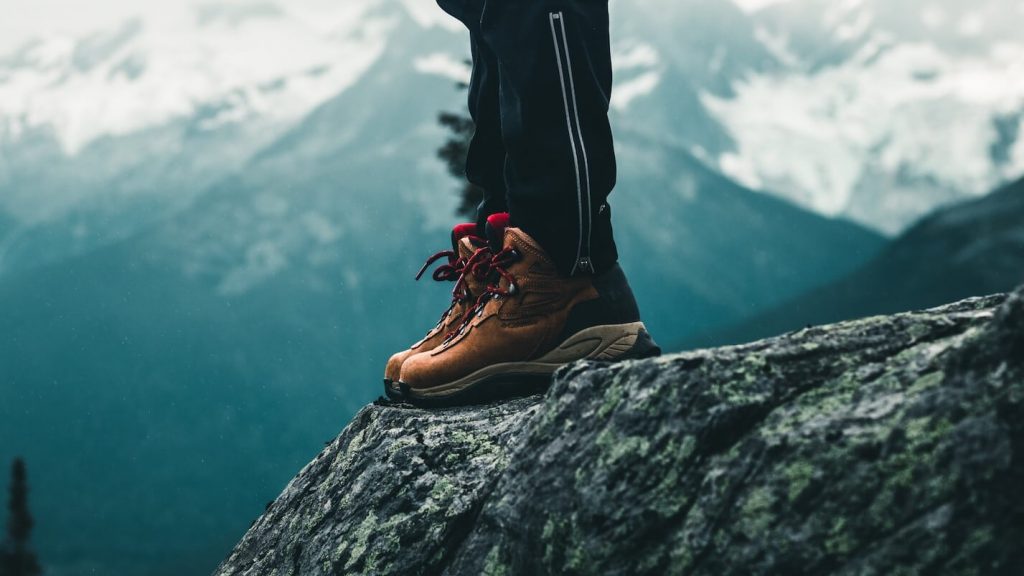 A person equipped with sturdy hiking boots for outdoor adventures.